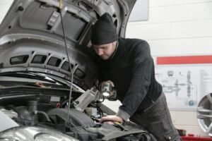 a man working on a car